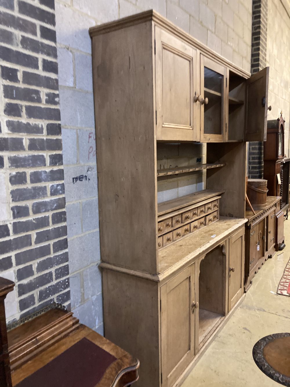 A large Victorian pine dresser, width 182cm depth 48cm height 240cm